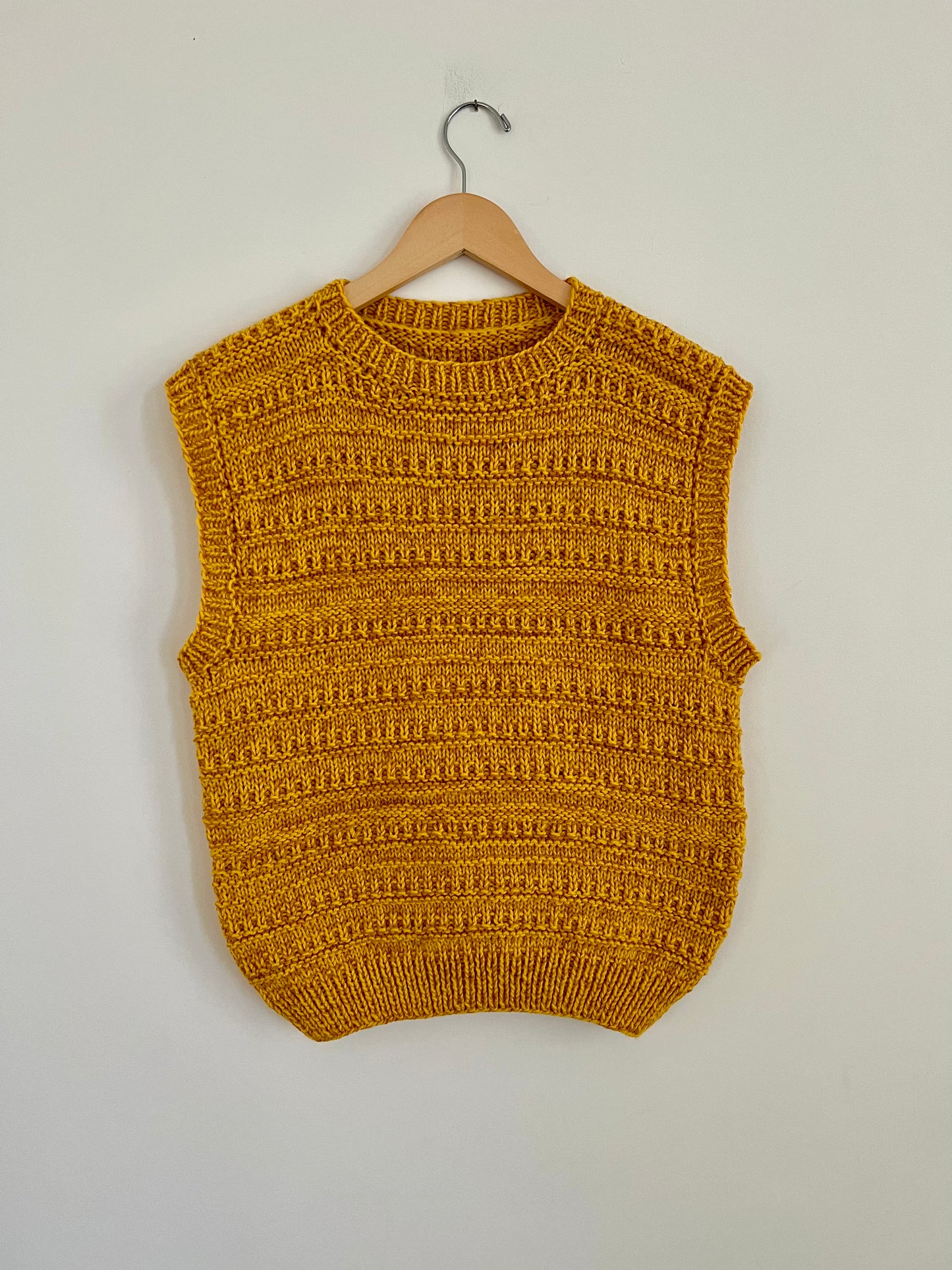 Hand knit vests by Upcycle